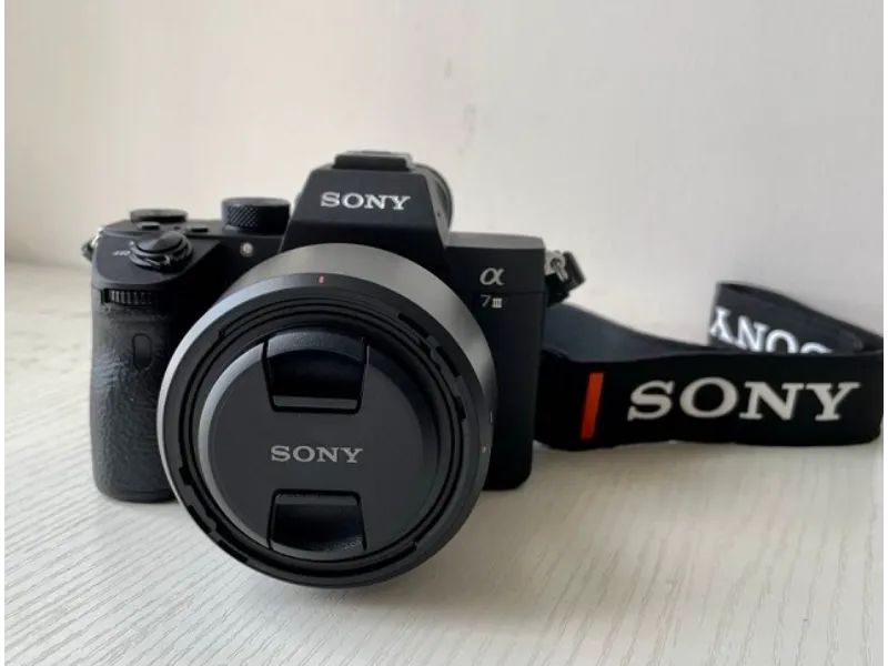 Sony Mirrorless Camera with black body and black neck strap